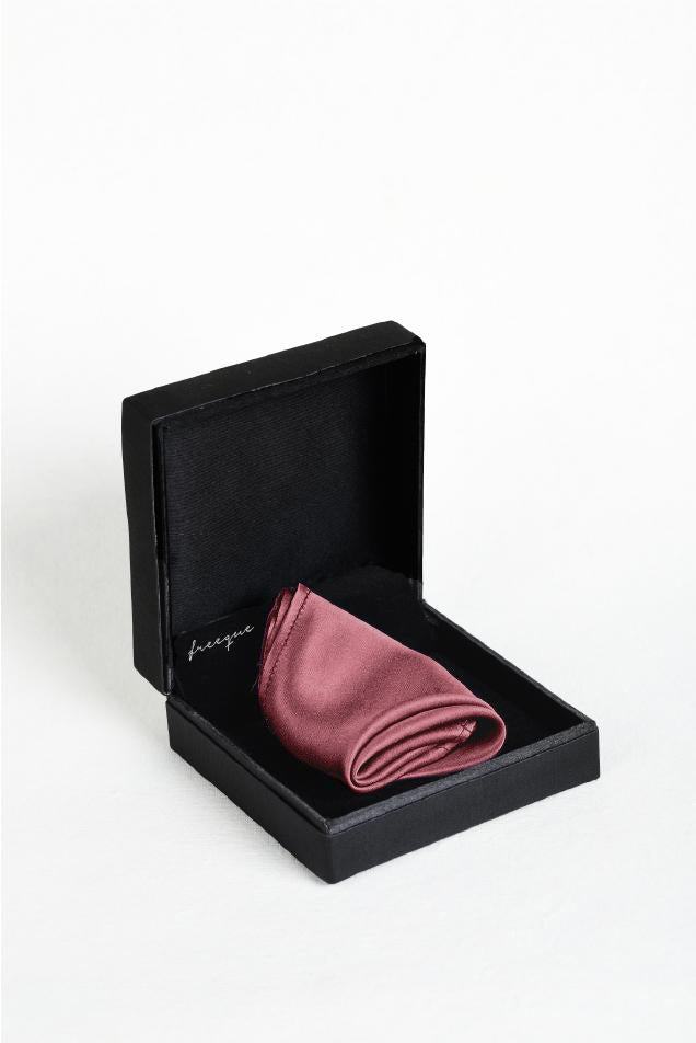 Close-up of solid dusty rose scented satin silk pocket square