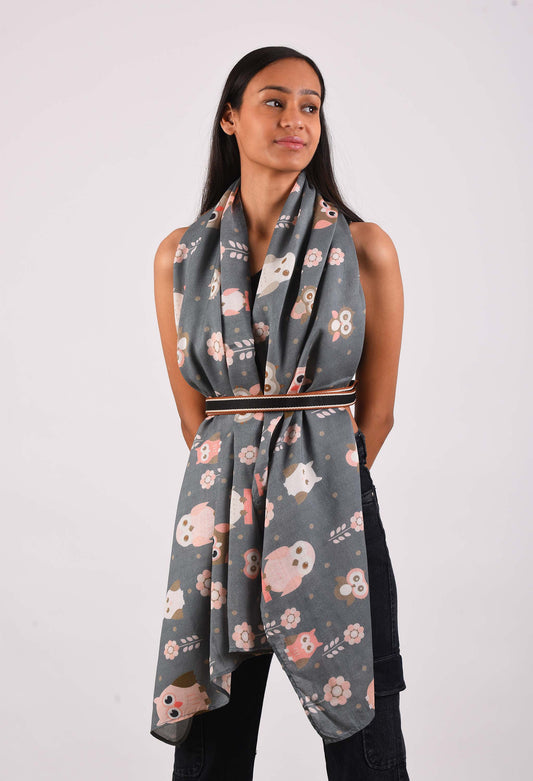 Model wearing Day Owl scented scarf with owl pattern, wrapped stylishly for luxury fashion