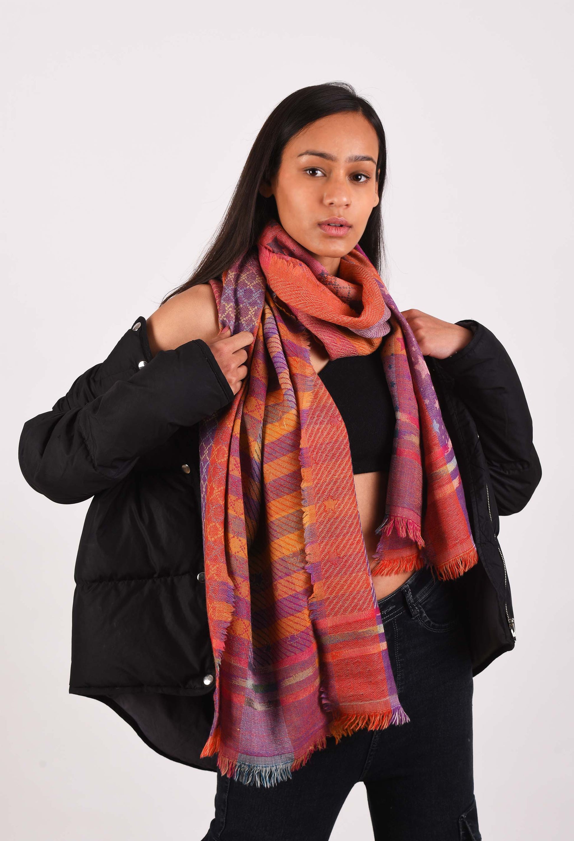 Female model wrapped in the Duchess camel wool stole for a warm and elegant winter look.