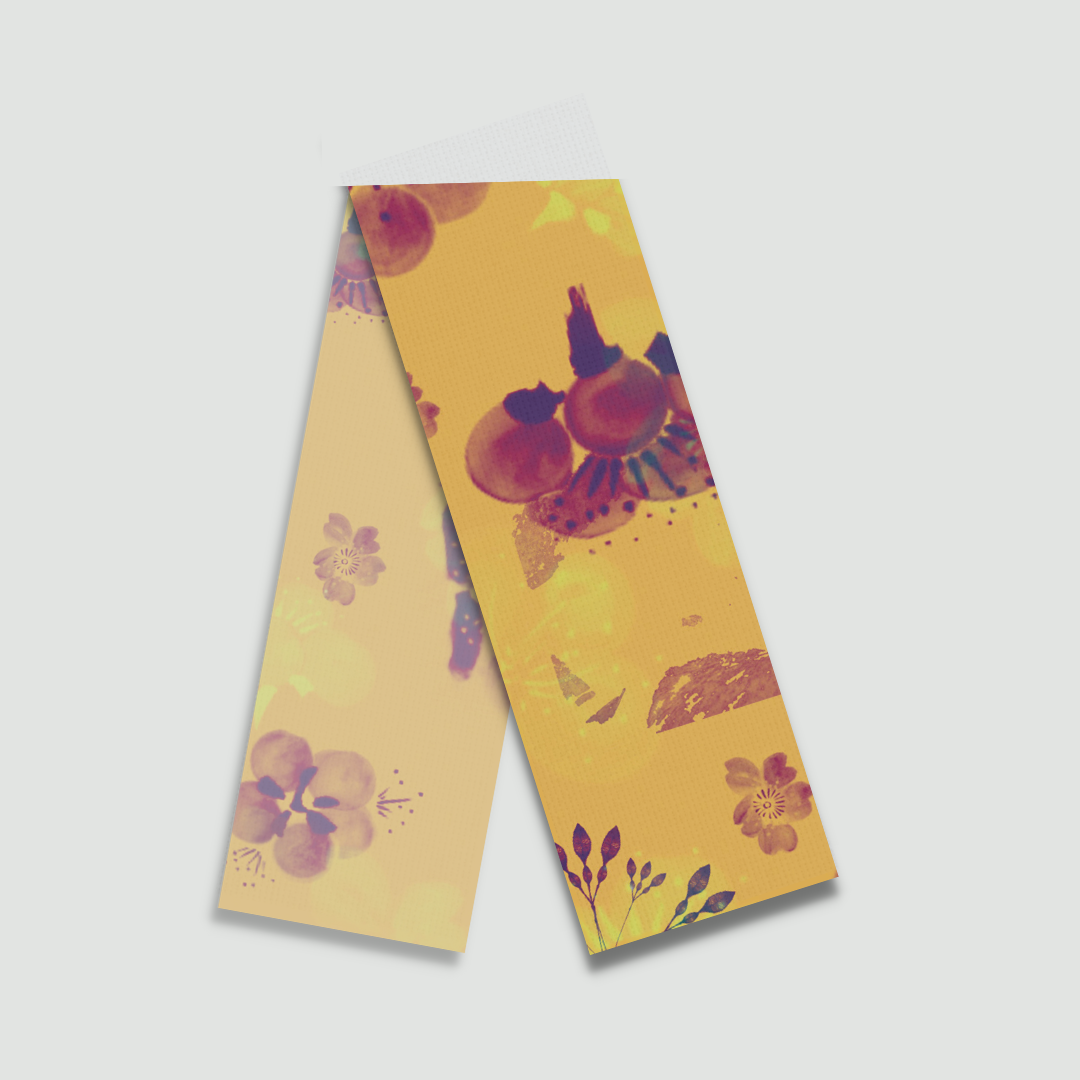 Flat lay of Egg'xotic Floret yellow floral stole with vibrant flower patterns