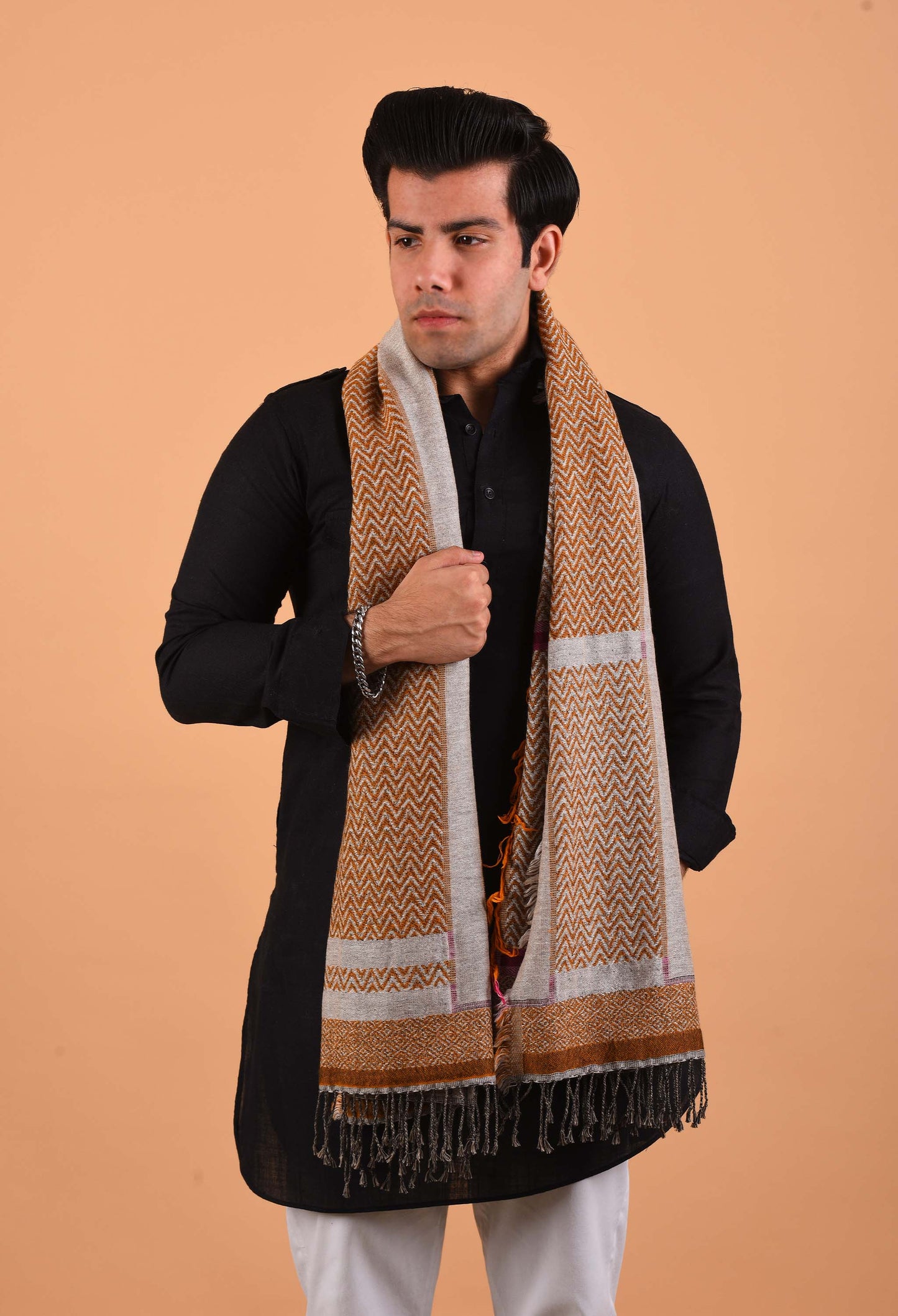 Model wearing a luxurious Flynn stole in camel wool, styled elegantly with traditional attire