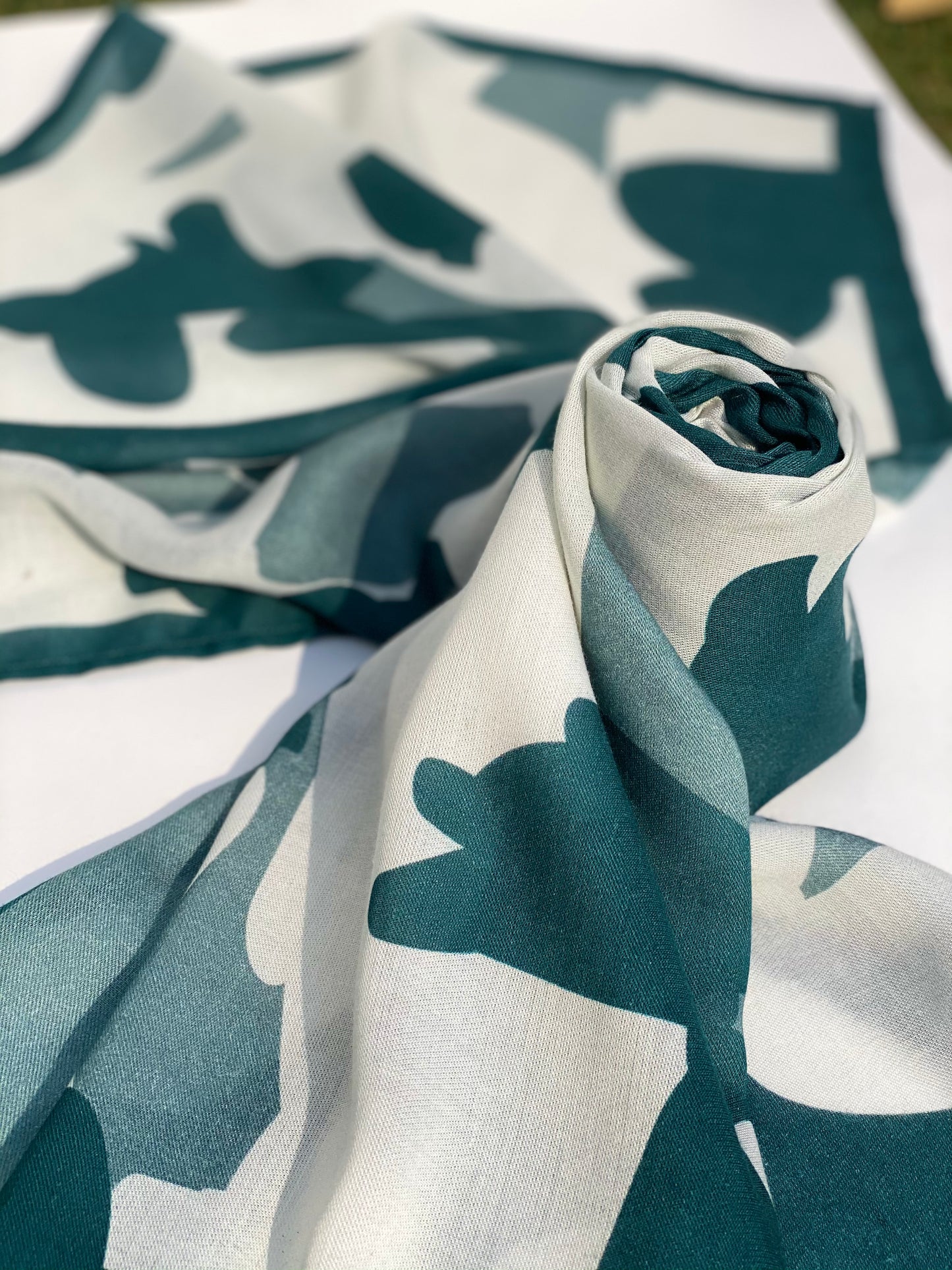 Close-up of Milky Tide scented stole in twill modal, with abstract design.