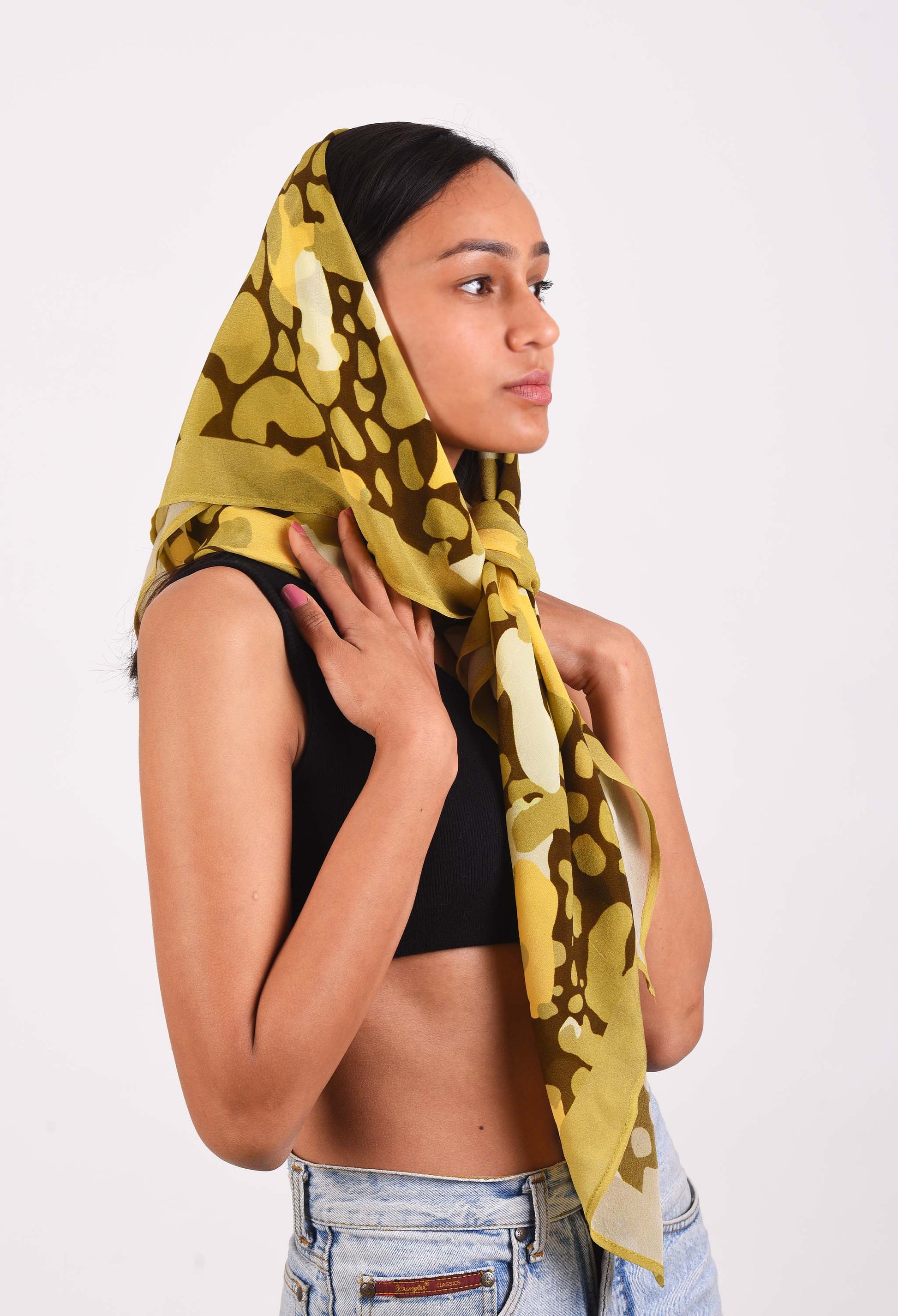 Model wearing Olive Island scented bandana by Freeque in olive green shades.