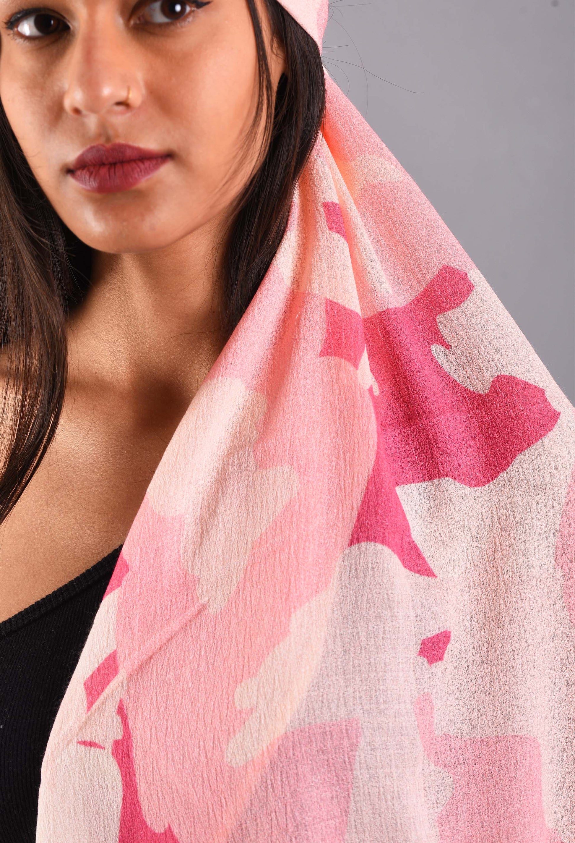 Close-up of Rosé pink scented stole fabric draped over shoulder, showcasing its texture.