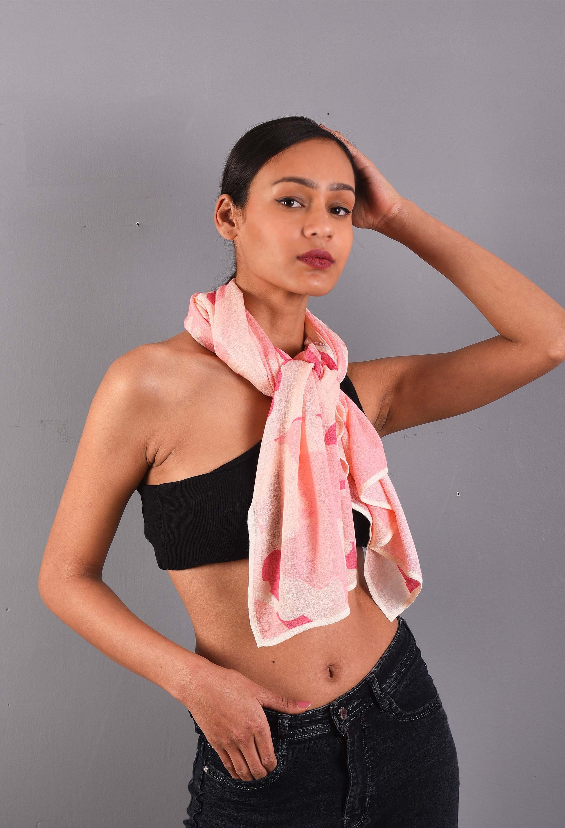 Model wearing a Rosé pink scented stole, styled as a loose draped scarf.