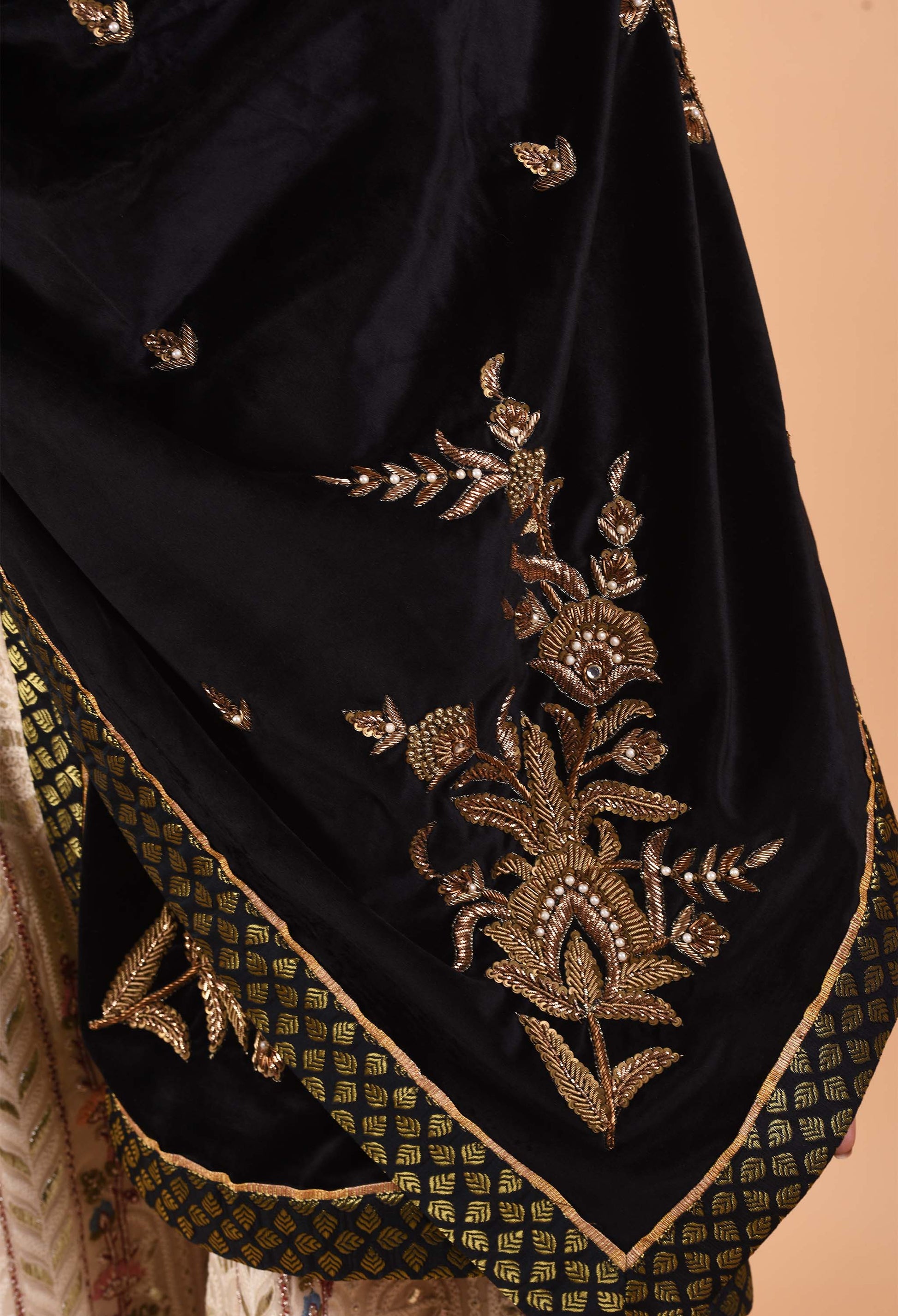 Detail of zardozi hand embroidery on black suede velvet shawl.