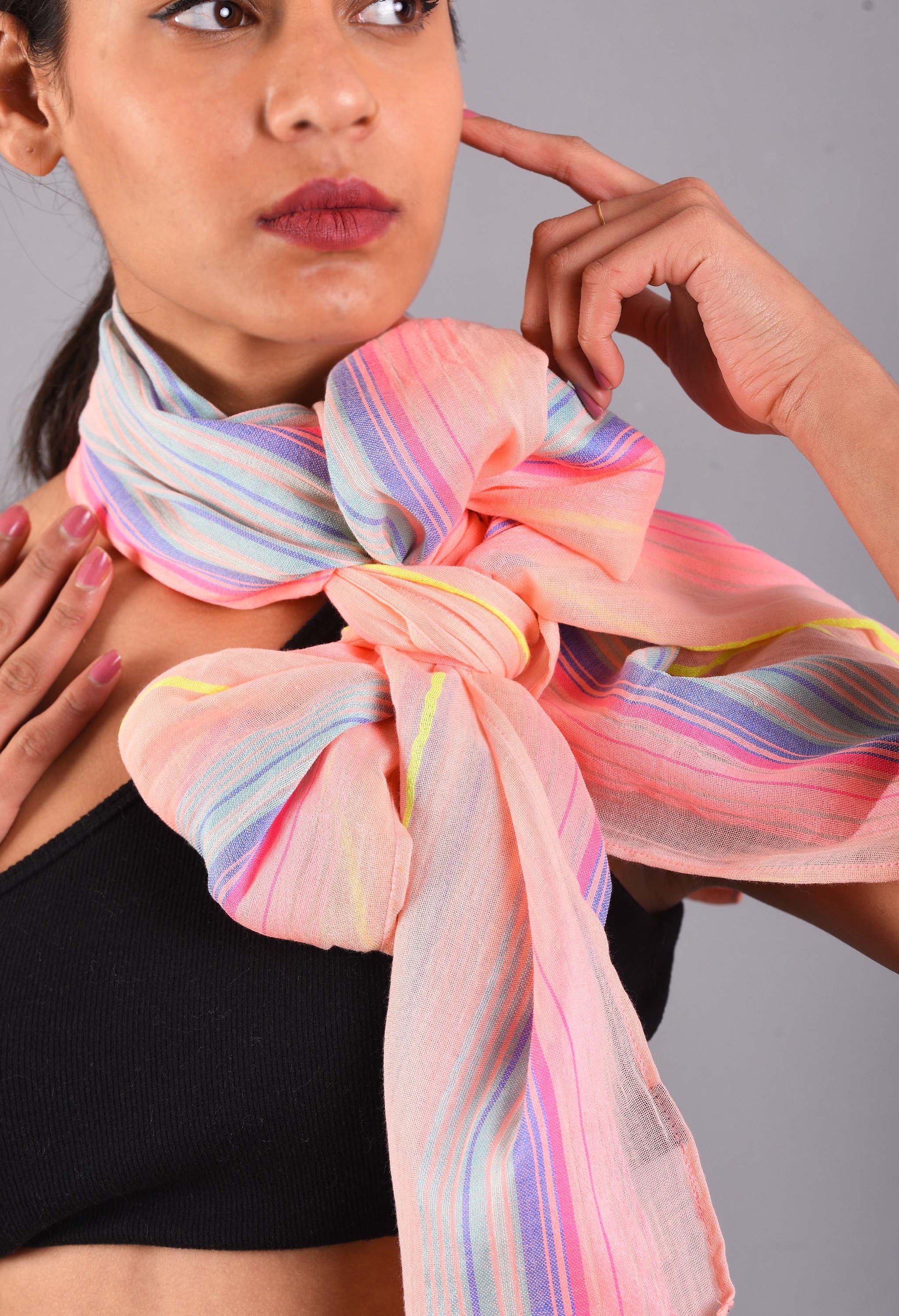 Close-up of the Salmon Streak scented stole tied elegantly around the neck, showcasing its vibrant salmon and pastel colors.