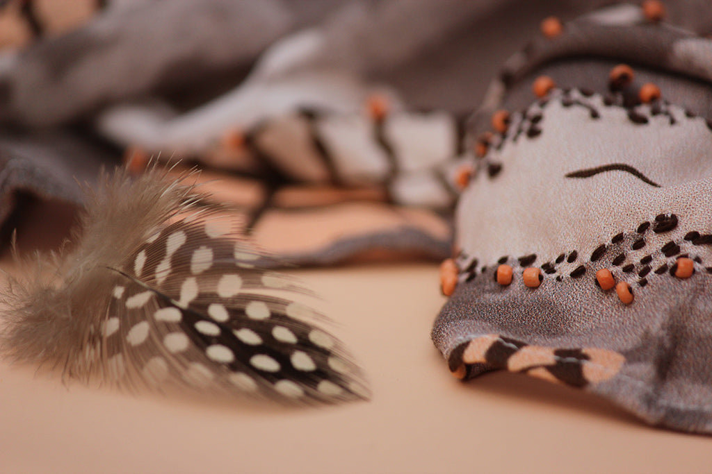 Close-up of embroidered feather details on Smokey Plumage scented stole